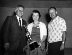 Female UNA Member Receiving an award