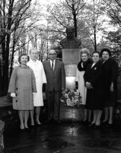 5 Female and 1 Male Member of The UNA gathered around Taras Shevchenko bust at Soyuzivka