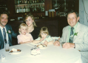 Family sitting at table during the 1978 UNA General Assembly Meeting
