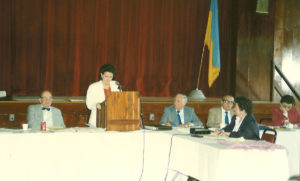 Woman giving speech at 1978 UNA General Assembly Meeting