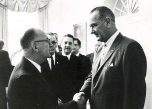 US President Lyndon B Johnson shaking hands with UNA Board Member