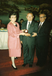 1994 UNA Jersey District 100th Anniversary Man receiving a desk clock