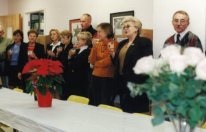 2002 UNA Christmas Party with employees caroling