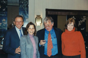 2005 UNA Christmas party 4 people laughing