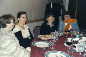 2005 Christmas Party two women smiling for a photo