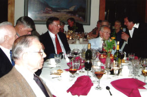 2005 UNA General Assembly Meeting people gathered at tables eating and listening to a live performance