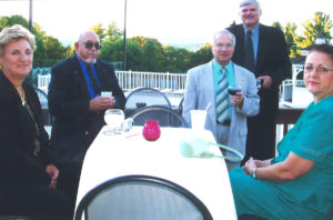 2005 UNA General Assembly Meeting men and women gathered around table talking